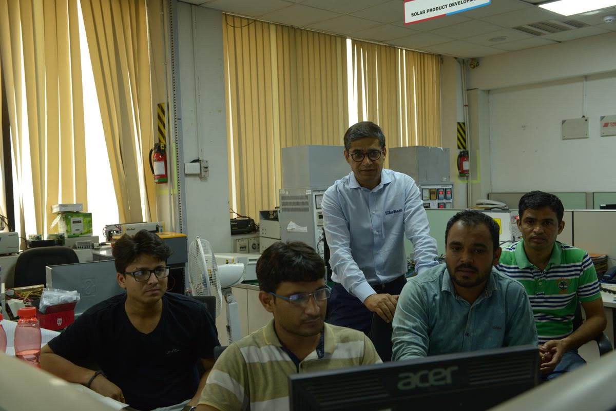 Kunwwer Sachdev working with his team