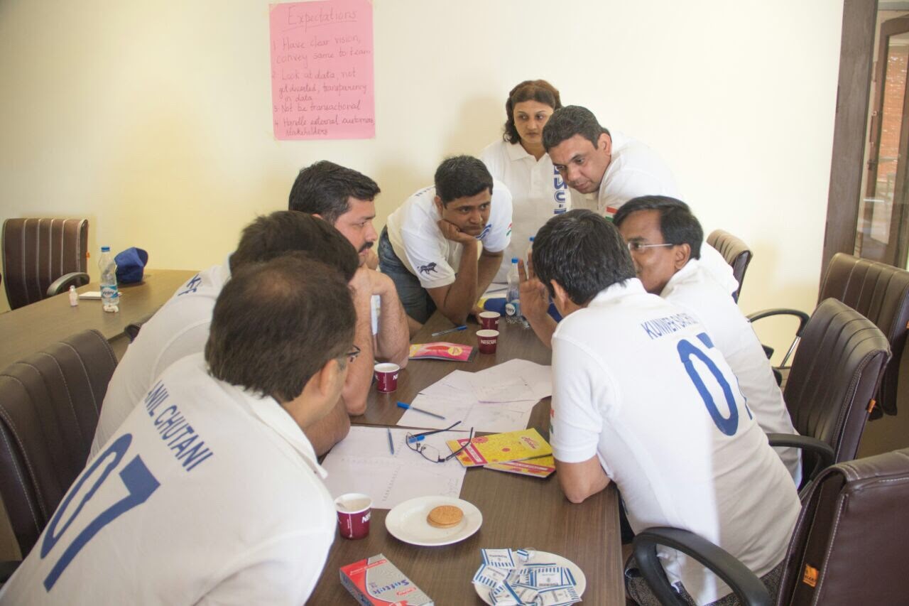 Kunwer Sachdev discussing ISO 9001 quality standards with Su-Kam employees in a quality management meeting