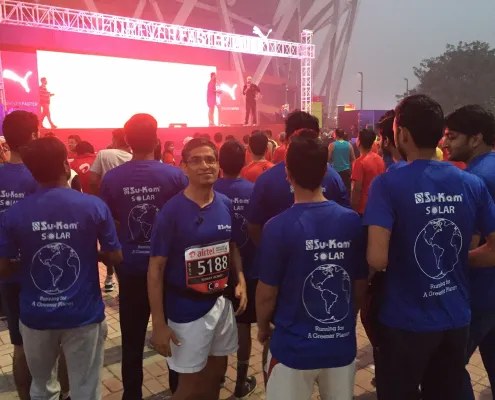 Kunwer Sachdev and Su-Kam Solar colleagues at the Airtel Delhi Half Marathon in Running for A Greener Planet shirts