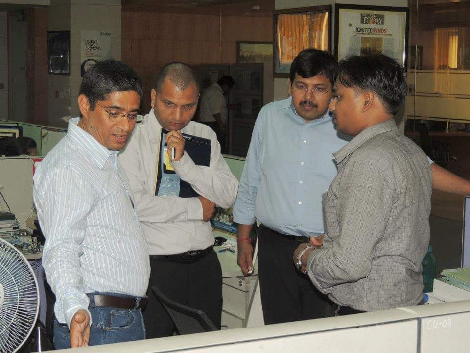 Engineering team reviewing hardware at the bench — practitioner jury model for deep-tech grant evaluation